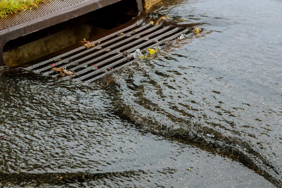 water running down a storm drain