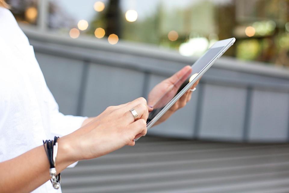 Person holding a tablet